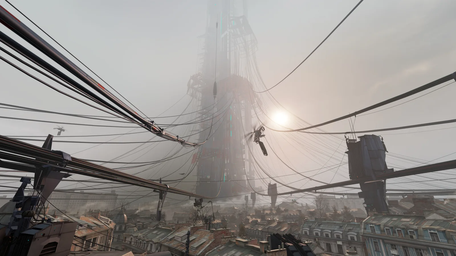 A fog-covered Combine tower rises over a rooftop skyline, with cables strung across the frame and a drone in the air.