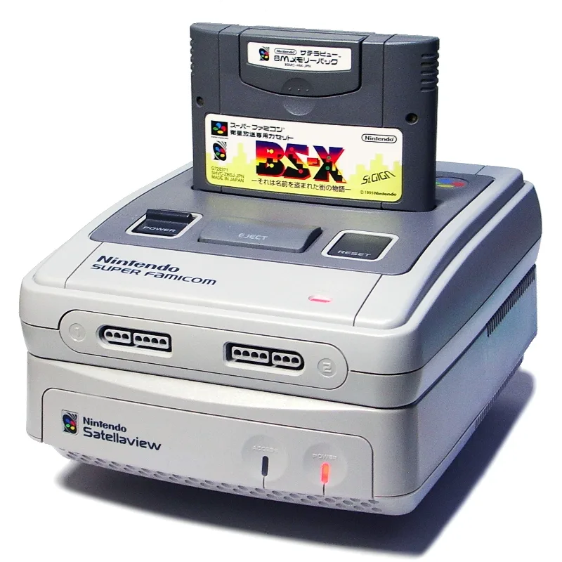 A Satellaview unit under a Super Famicom, with a BS-X cartridge and an 8 Mb memory pack plugged into the top