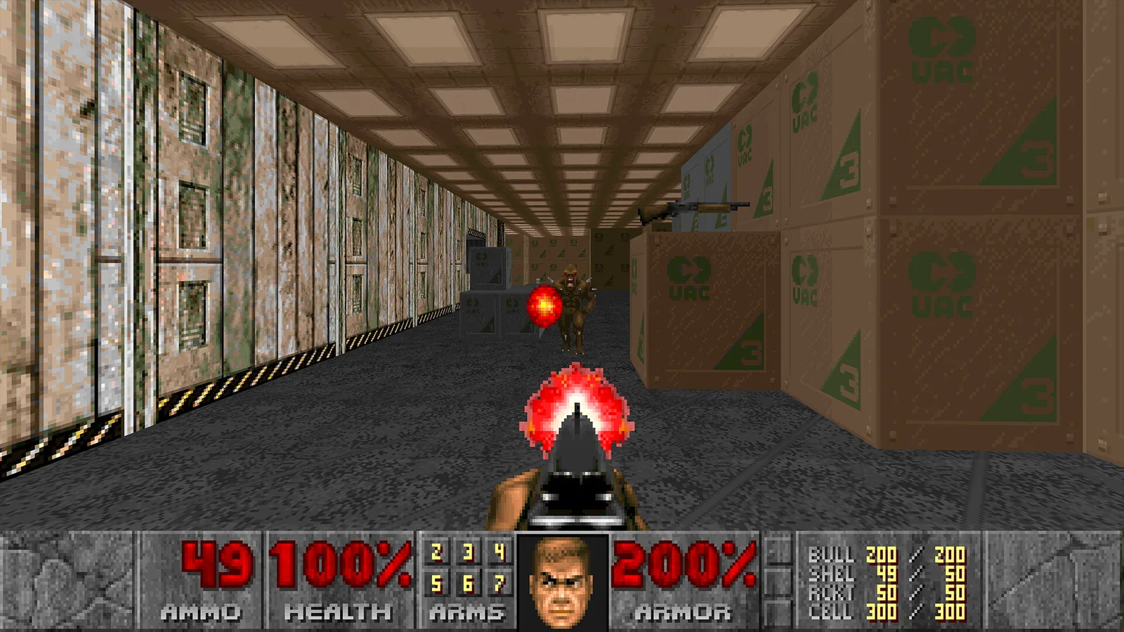 First-person view down a corridor of UAC crates, with a shotgun muzzle flash and an enemy firing a fireball