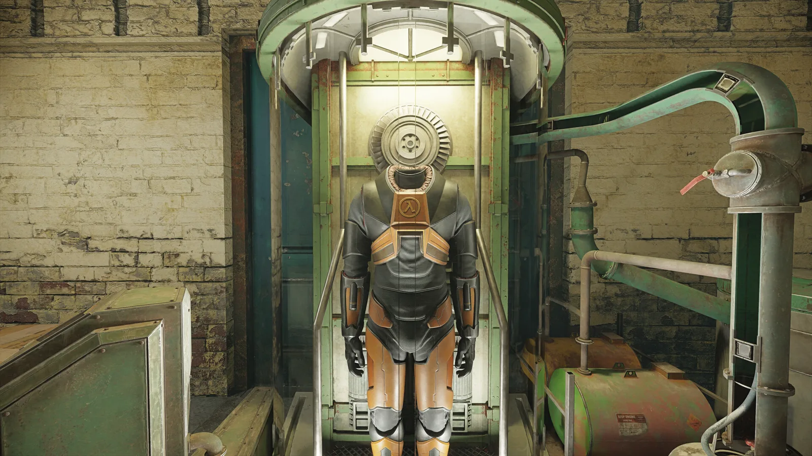 The orange and black HEV suit standing in a glass-fronted charging cabinet in a brick room with green pipes