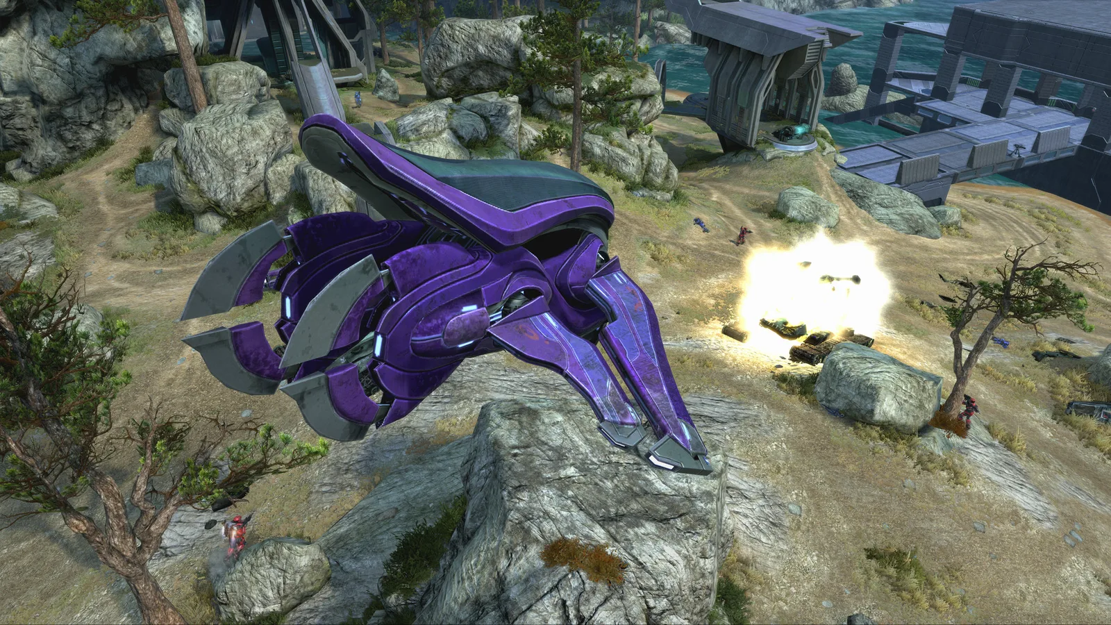 A purple Banshee perched on a rocky outcrop above a firefight, seen from a high camera in Combat Evolved Anniversary
