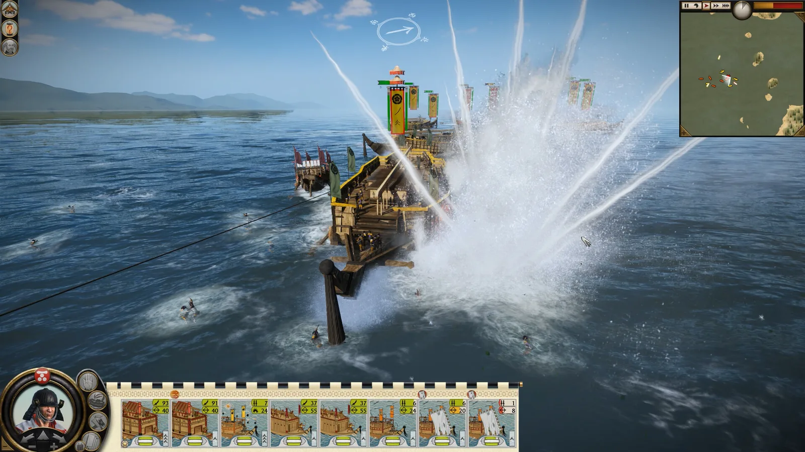 A Japanese warship rams through a heavy splash on open water, with the unit cards and minimap on screen