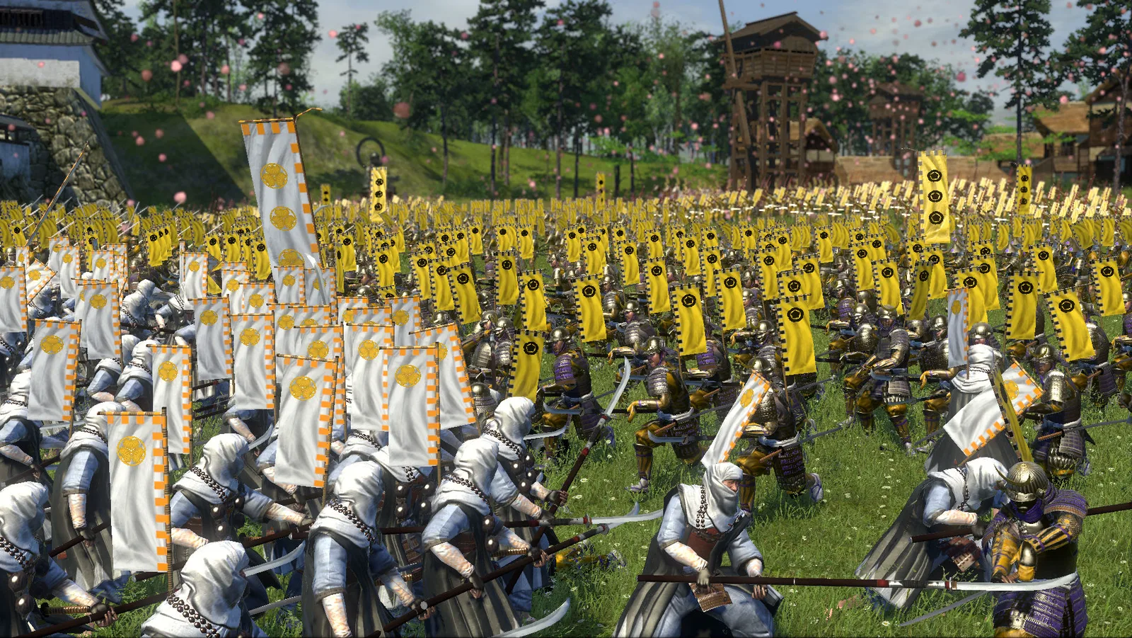 Two armies of foot soldiers with white and yellow banners meet on a grass field in front of a castle wall