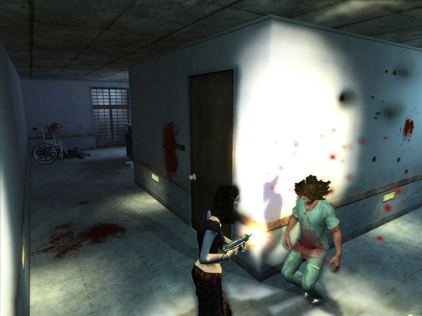 A dark-haired woman fires a submachine gun at a man in green scrubs in a blood-spattered hospital corridor.